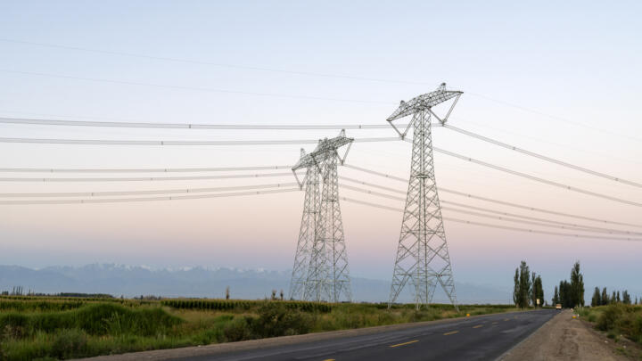 Electricity grid against the skyline.