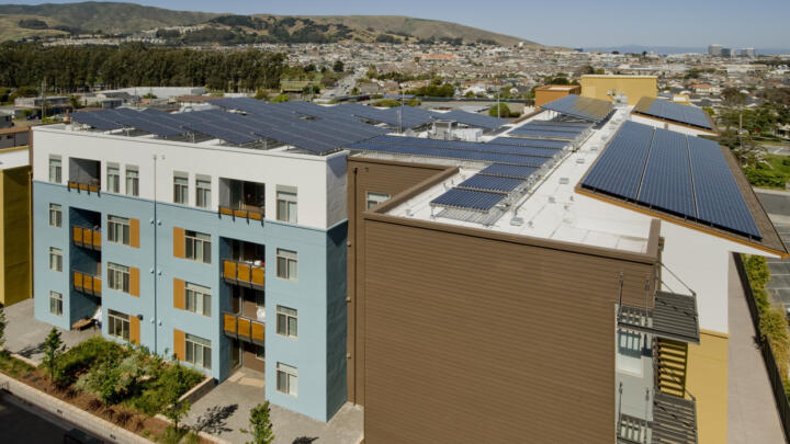 Solar panels on the roofs of apartment buildings.