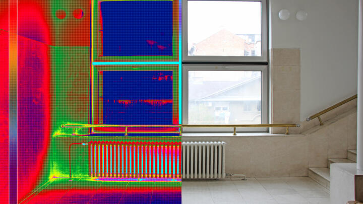 Thermal image showing heat loss around windows in a home.